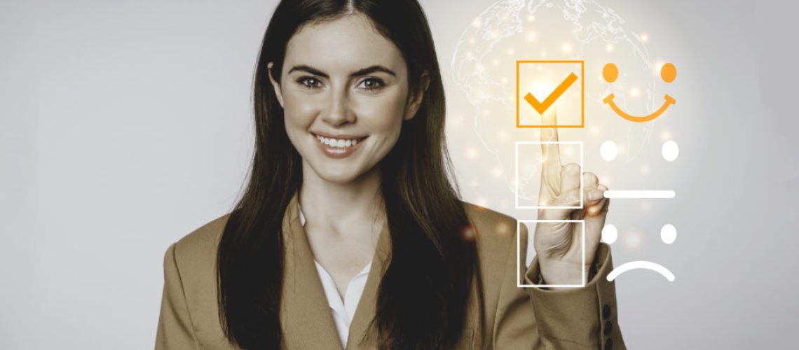 Young business woman checking on satisfaction checklist box.Copy space.